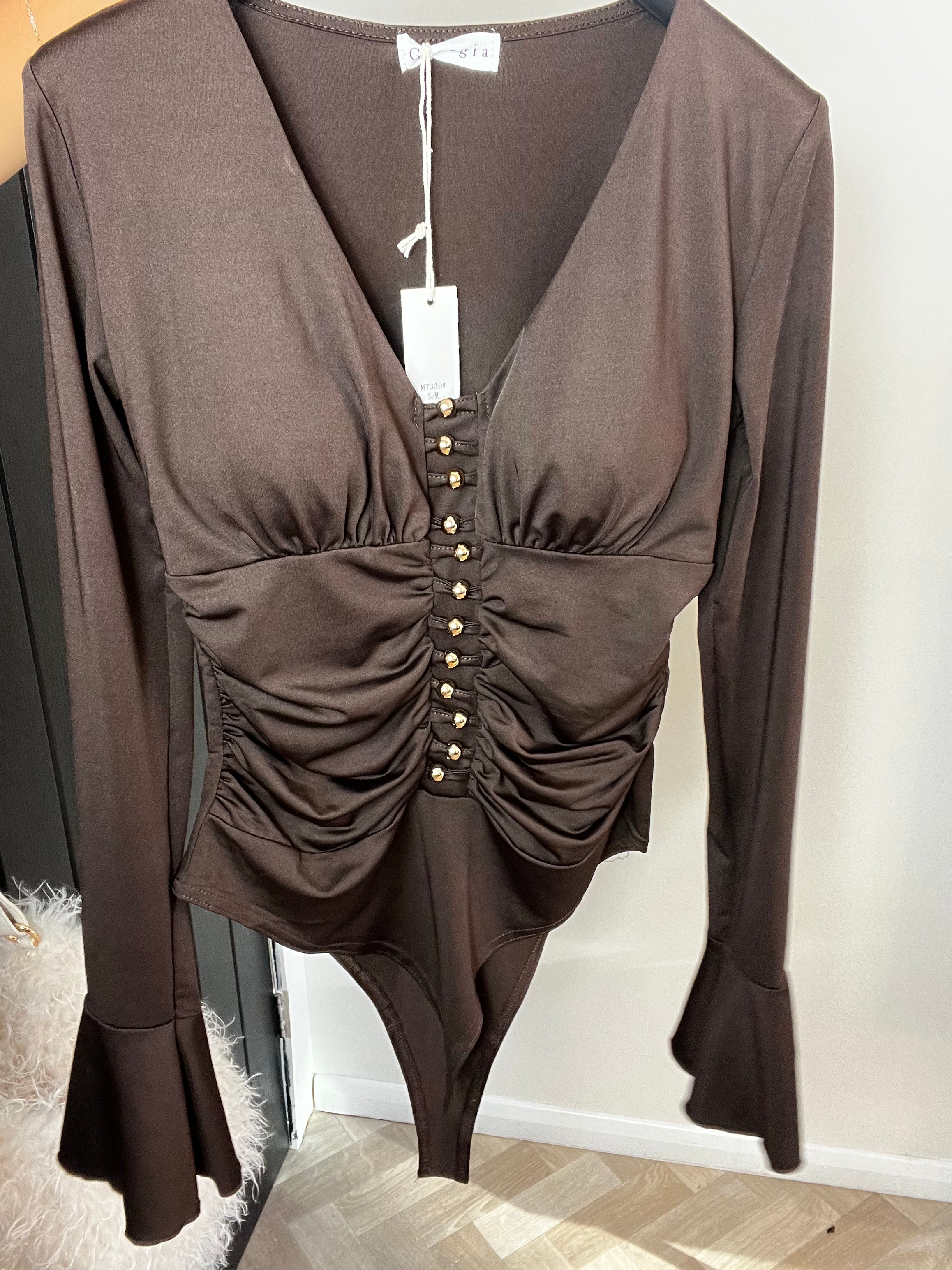 Chocolate body gold detail